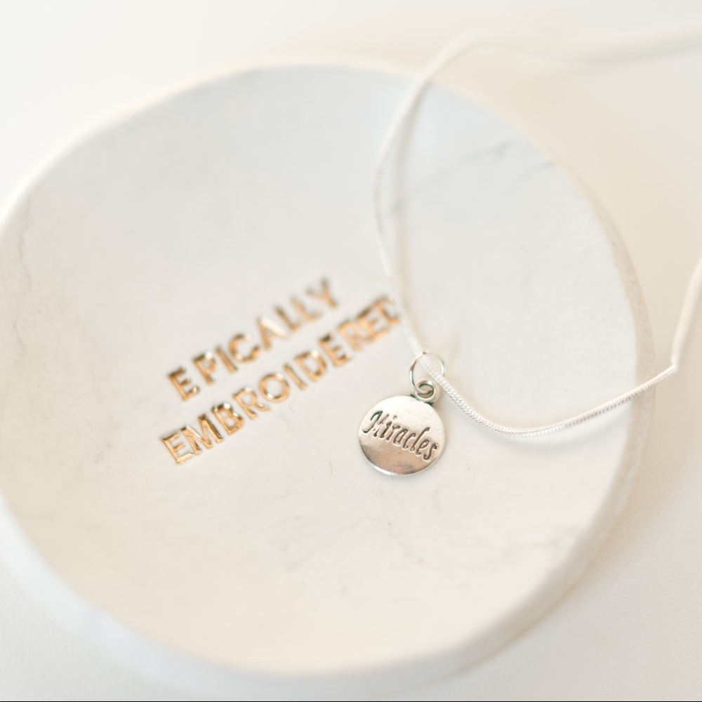 22 inch silver necklace with miracles charm